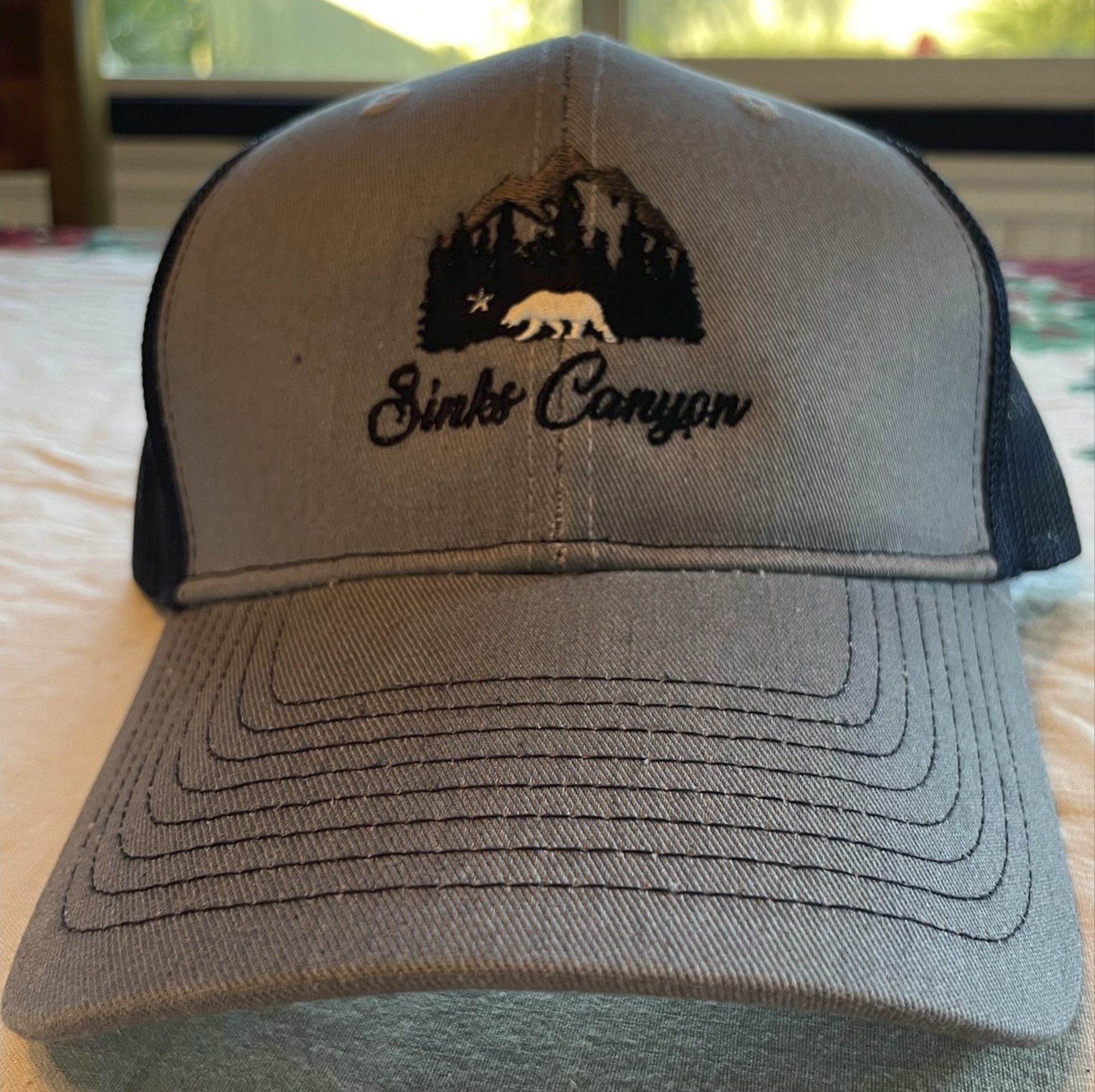 Heather Grey / Rich Navy Trucker Hat